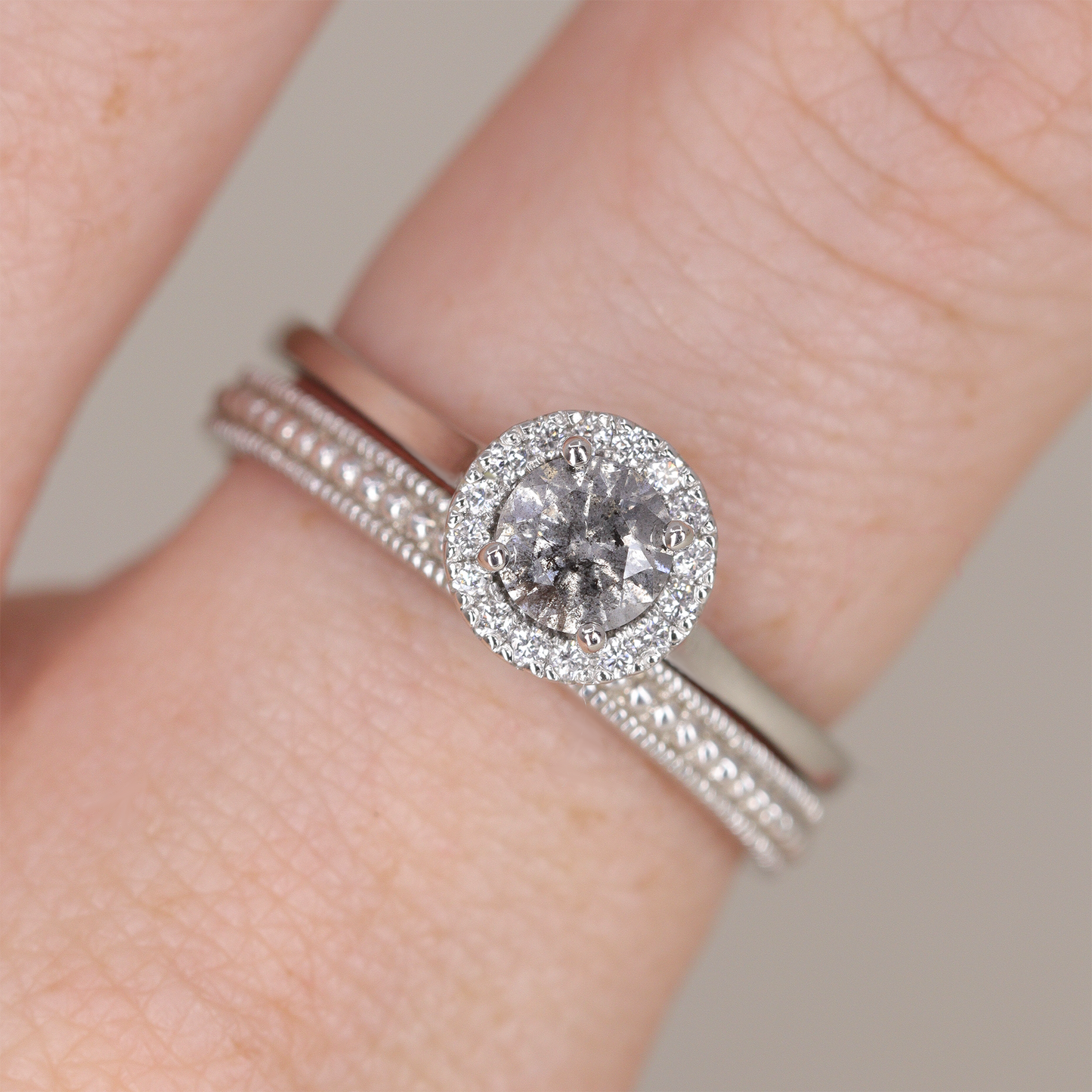 Salt and pepper round cut diamond white diamond halo engagement ring in platinum
