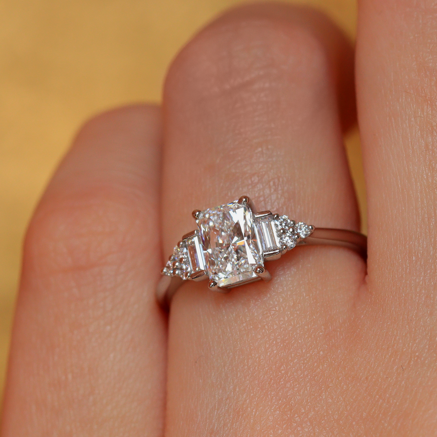 Art deco inspired radiant cut white diamond engagement ring