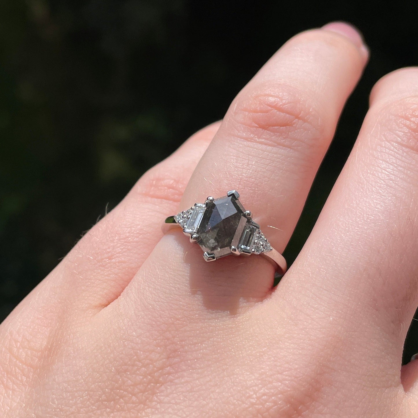 Elongated hexagon salt and pepper diamond engagement ring in platinum