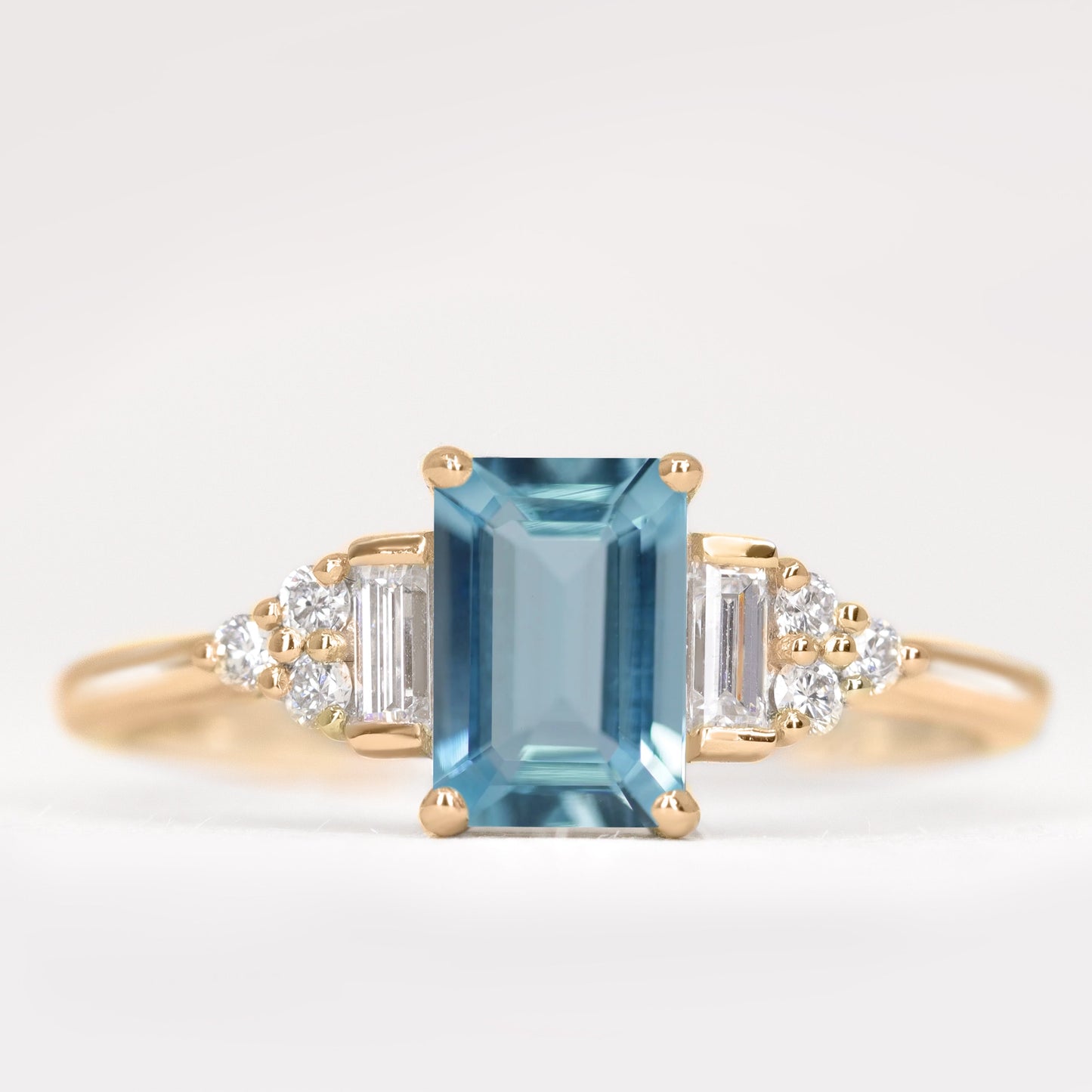 Art deco inspired emerald cut aquamarine and white diamond engagement ring