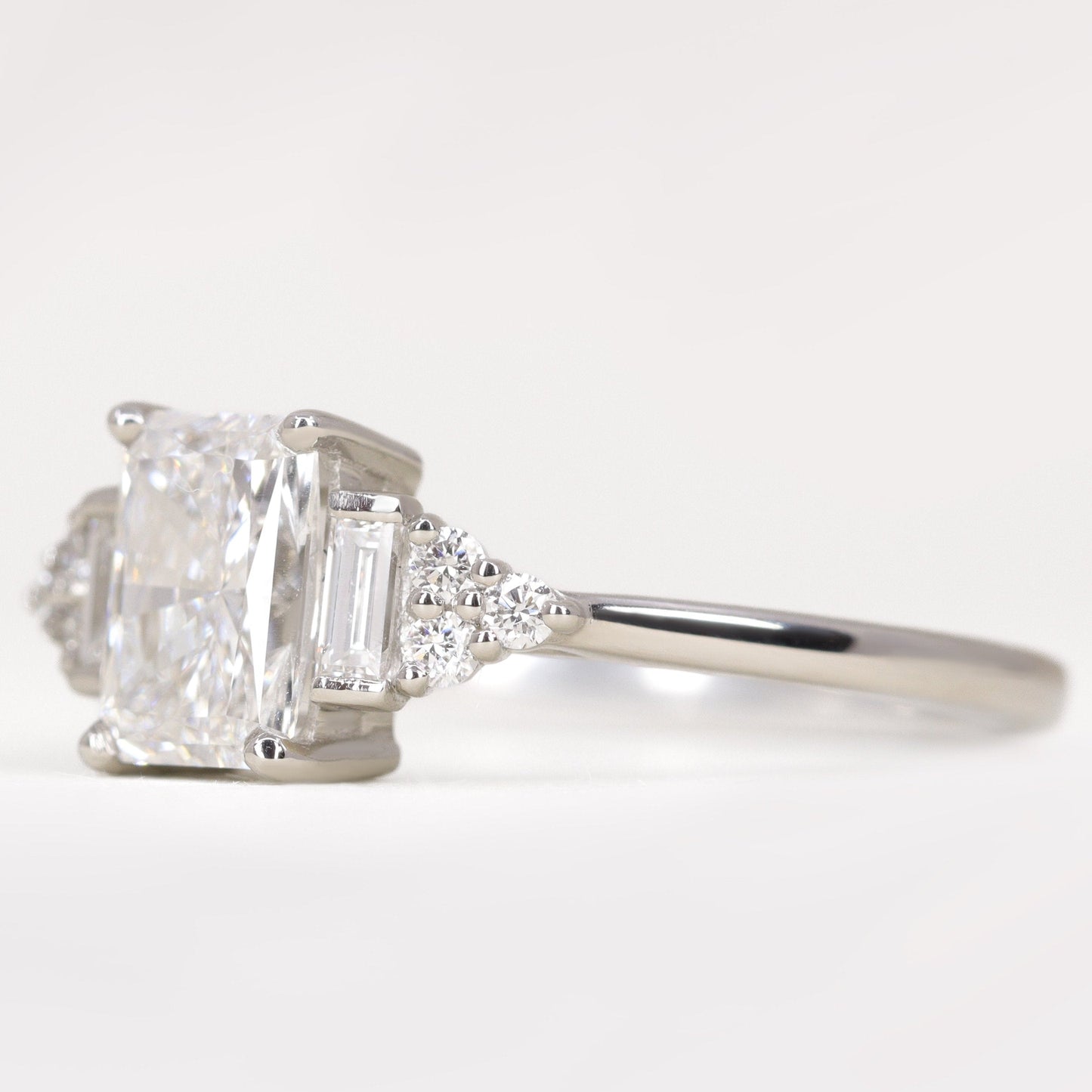 Art deco inspired radiant cut white diamond engagement ring