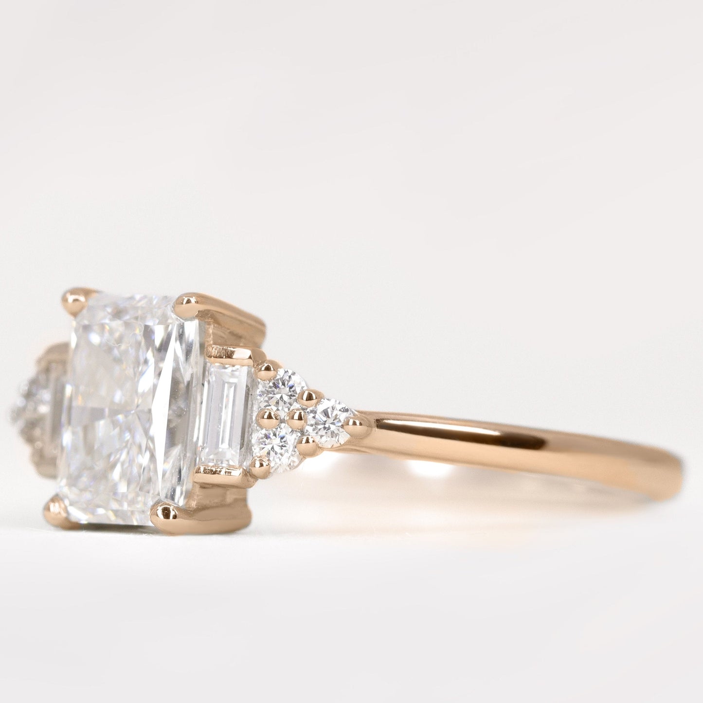 Art deco inspired radiant cut white diamond engagement ring