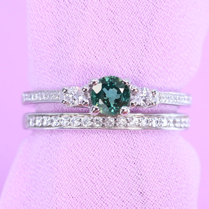 Teal sapphire and diamond engagement ring and diamond wedding ring set