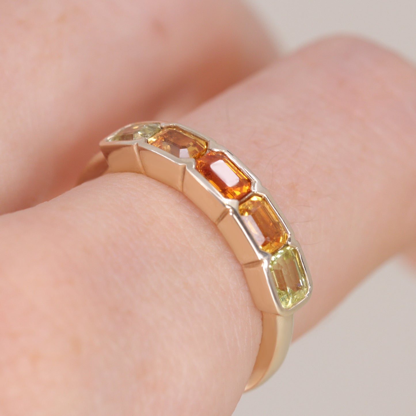 Half bezel rubover yellow and orange sapphire eternity stacking ring
