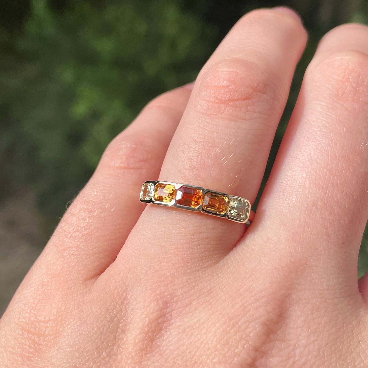 Half bezel rubover yellow and orange sapphire eternity stacking ring