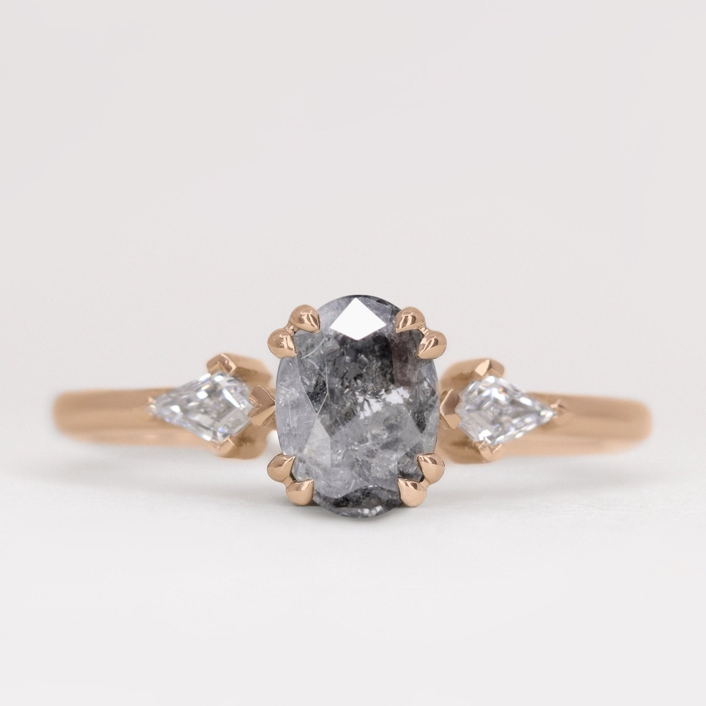 Oval salt and pepper diamond and white diamond trilogy engagement ring