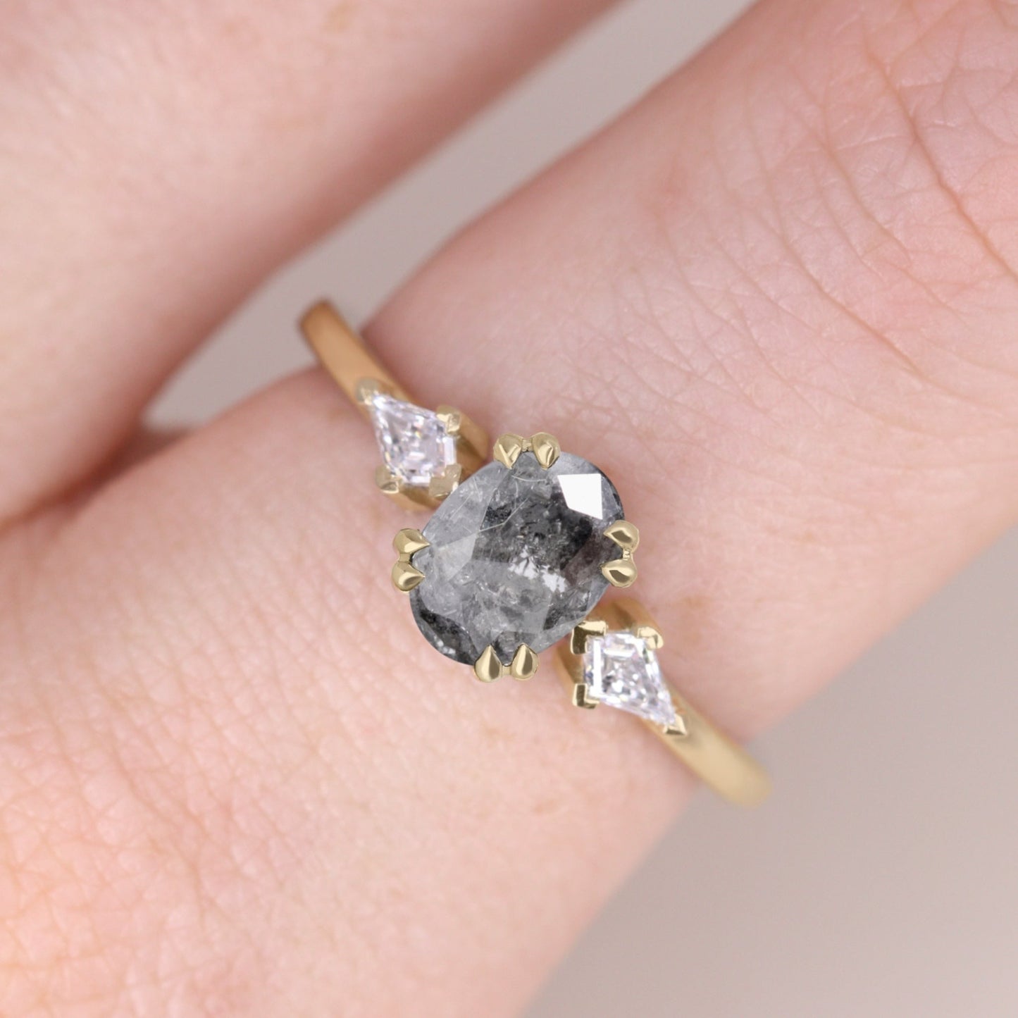 Oval salt and pepper diamond and white diamond trilogy engagement ring
