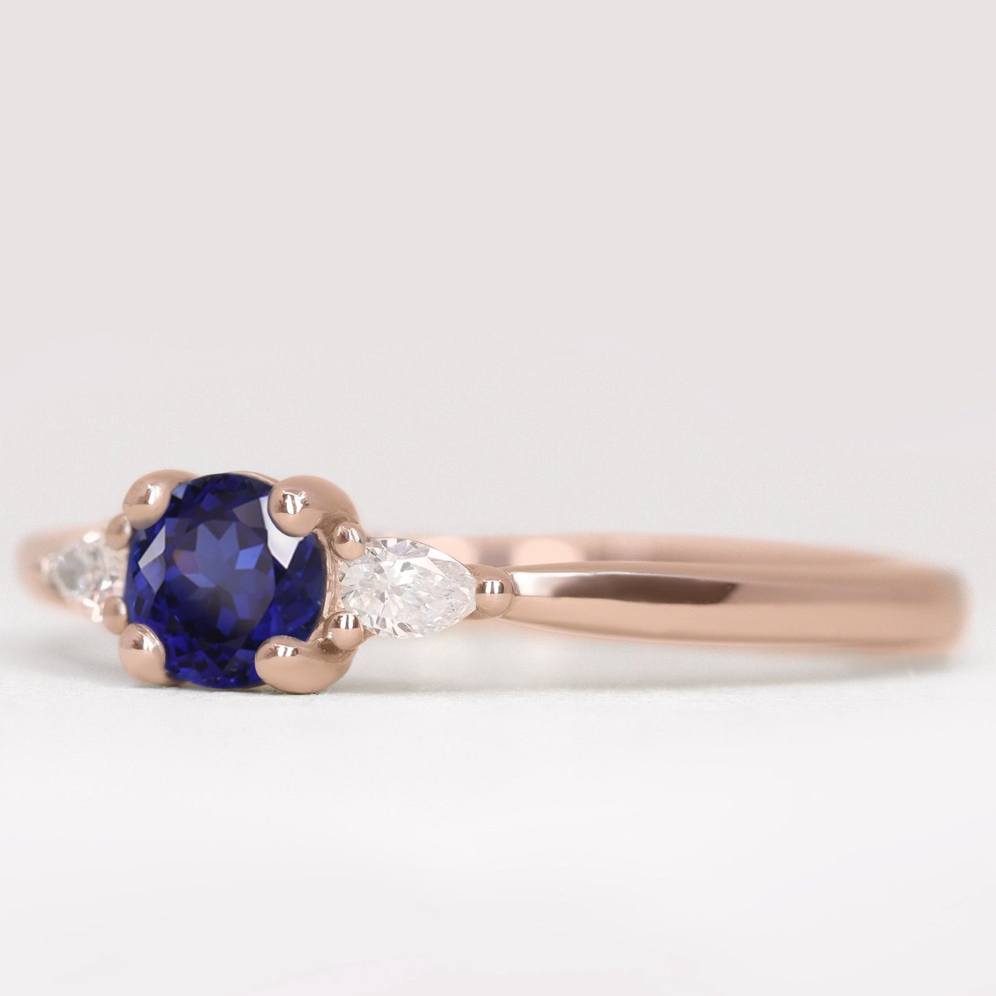 Unique round blue sapphire and lab grown diamond rose gold engagement ring