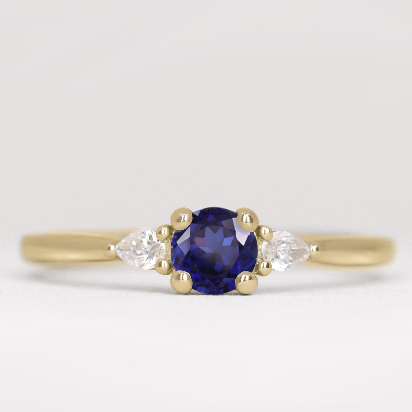Unique round blue sapphire and lab grown diamond gold engagement ring