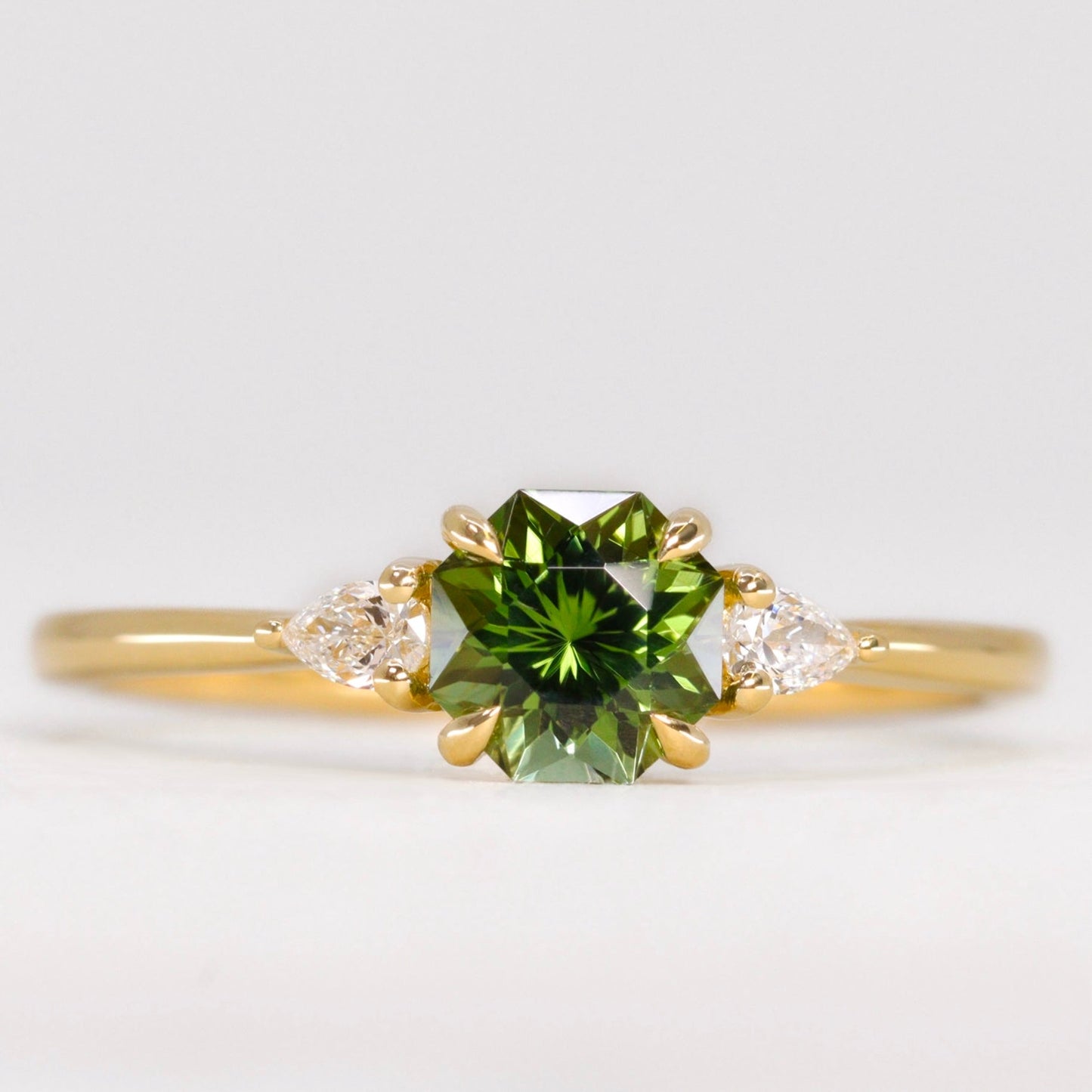 Green tourmaline and white diamond engagement ring yellow gold