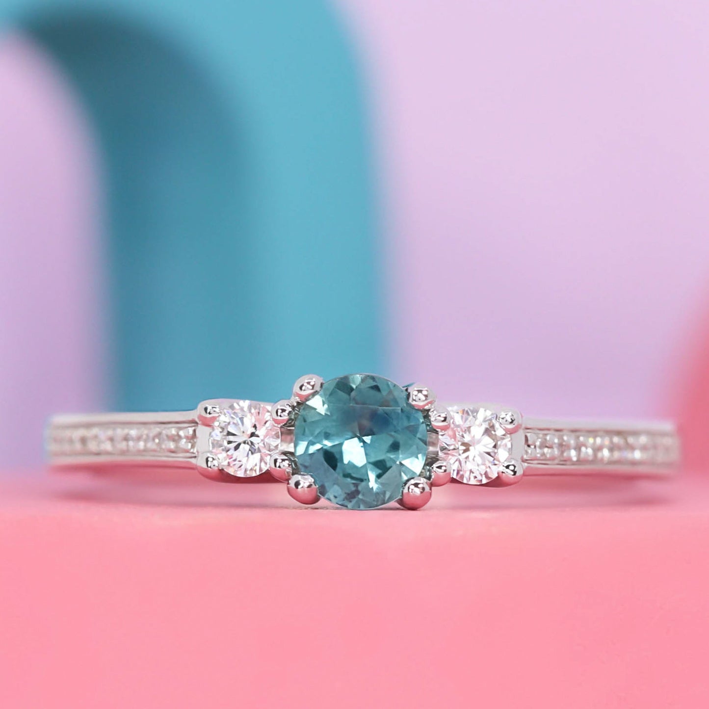 Teal sapphire and diamond engagement ring and diamond wedding ring set